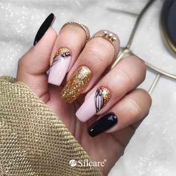 Gold and black – luxurious decorations on hybrid nails