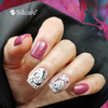 Pink hybrid nails with white flowers