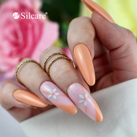 Unghie albicocca - manicure caldo con un delicato tocco floreale